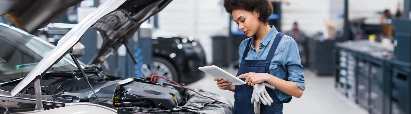 Mechanic working on a vehicle in a garage